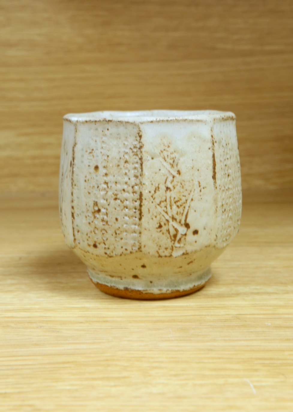 Phil Rogers (1951-2020), a studio pottery octagonal yunomi, 9cm. Condition - good, some crazing visible to interior